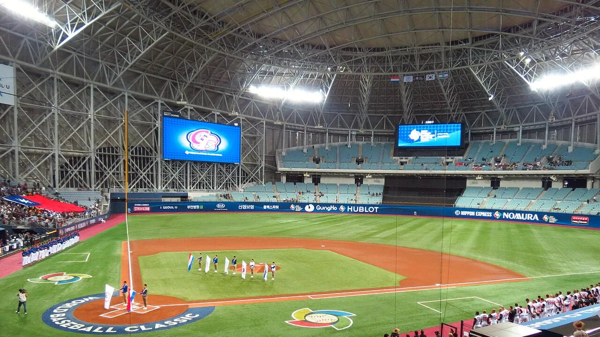 Interior seating, field and curved roof structure at Gocheok Sky Dome in Seoul