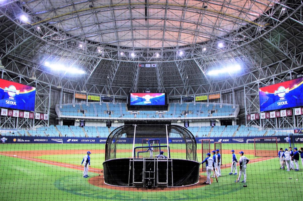 Wide interior view of Gocheok Sky Dome with the field and tiered seating visible