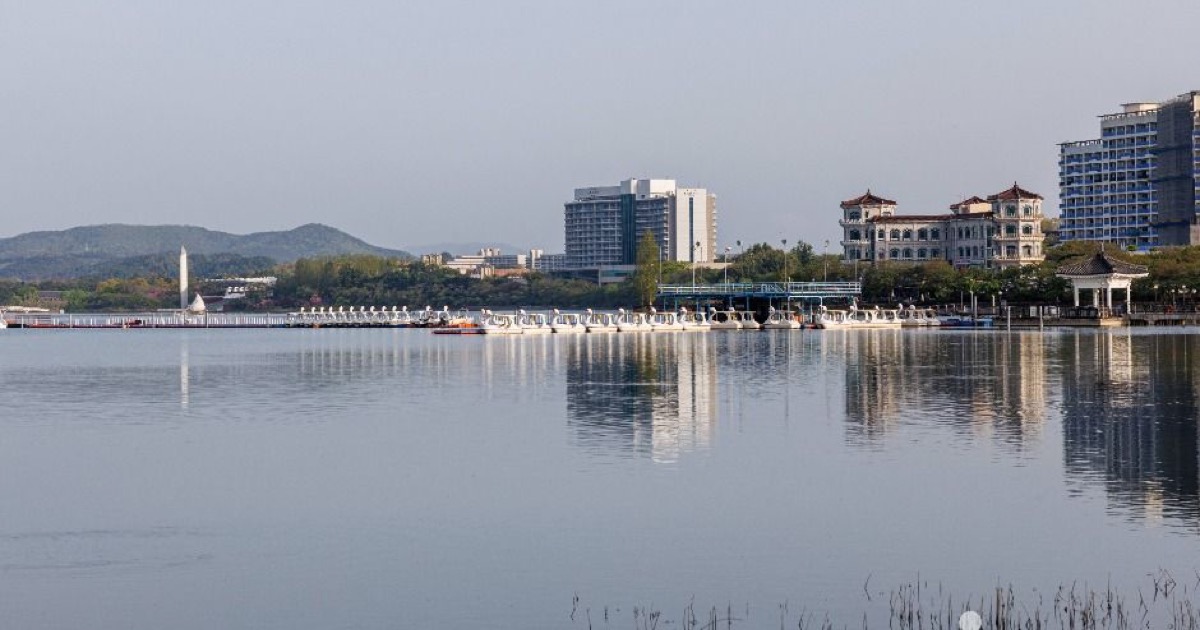 Calm water and lakeside buildings reflected across Bomun Lake in Gyeongju